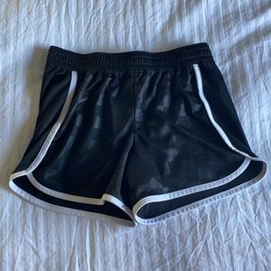 Black Umbro athletic shorts.